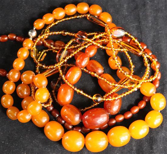 A reconstituted/pressed? amber necklace and two other necklaces.